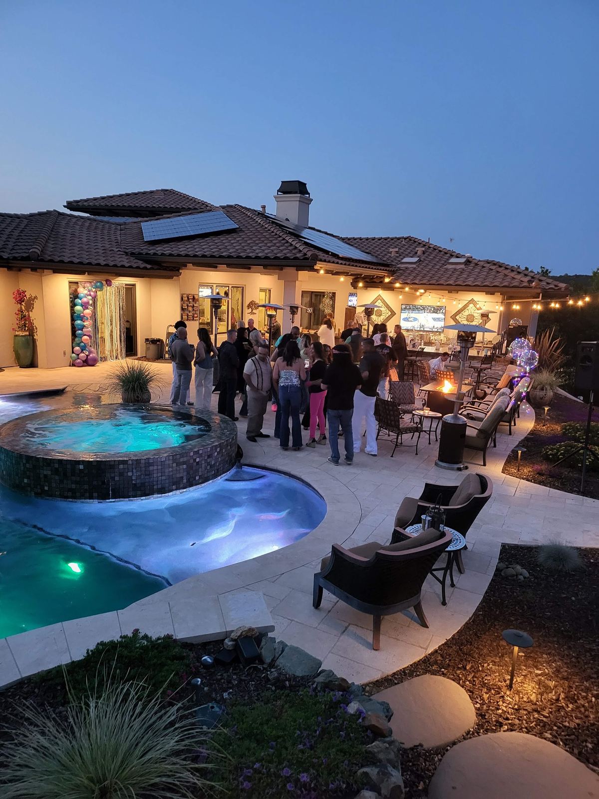 An evening party on the lit pool deck